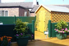 Classic Green gravel boards used around a sun deck.